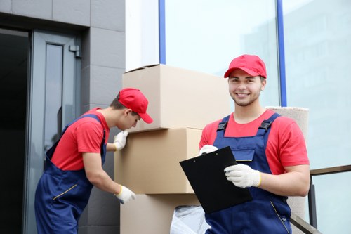 Packed boxes and moving equipment prepared for a Kensington house move