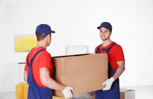 Removal team planning a move in a Kensington street