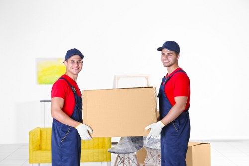 Removal van and moving team in a Kensington street