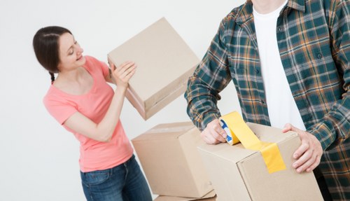 Furniture and boxes being moved from a Kensington flat