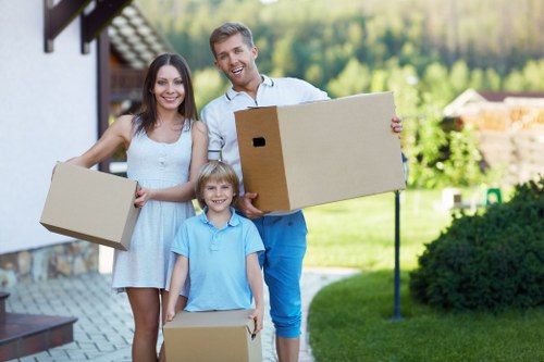 Moving crew wearing PPE while loading furniture safely