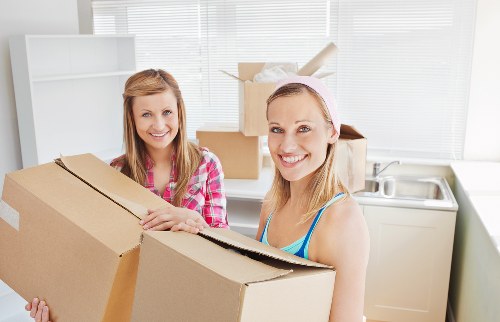 Loading household items into a van for a Kensington move