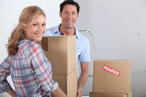 Local moving team handling furniture near Kensington streets